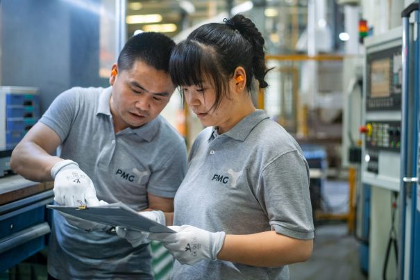 July 15, 2021, Shanghai China - (L-R): Zhou Ping and Liu Meiling at work in the SA area at the PMG factory.